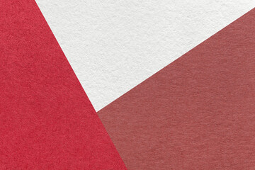 Texture of craft white, red and maroon color paper background, macro. Vintage wine abstract cardboard with gradient.