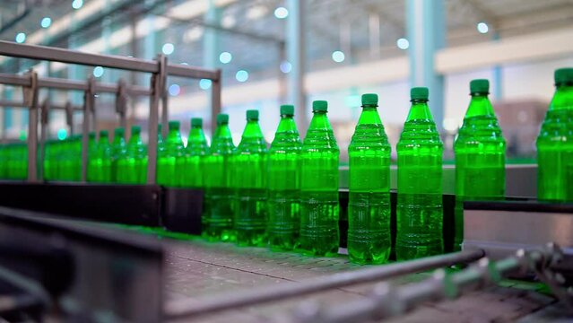 Row of bottle in conveyer at water factory