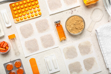 Mustard plasters with medicines on white background