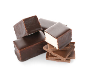 Tasty bird's milk candies and chocolate on white background