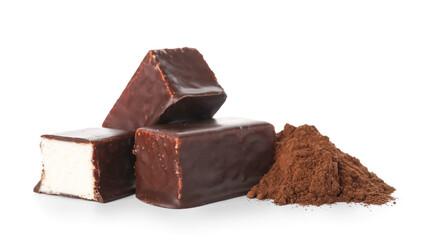 Tasty bird's milk candies and heap of cocoa powder on white background