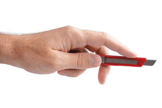 Man with red utility knife on white background