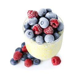 Glass of tasty chia seed pudding with berries on white background