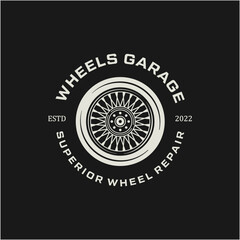 Vintage style car wheel logo vector design element for retro label or badge illustration.