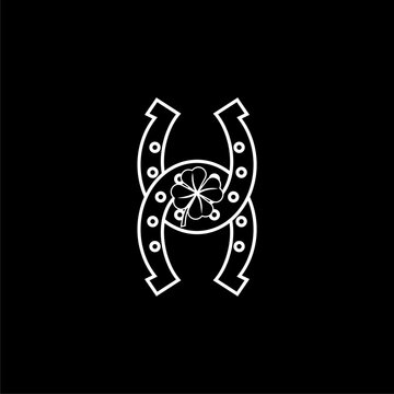 recommend clip art: Horseshoe with four leaf clover icon isolated on dark  background