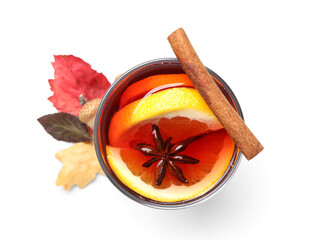 Glass of aromatic mulled wine on white background
