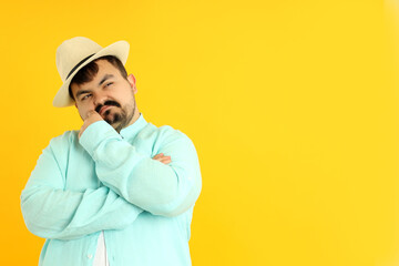 Concept of people, young fat man on yellow background