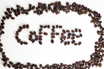 Coffee Beans on white background. Coffee grounds. Freshly roasted coffee beans. Image of a drink made from granules, derived from coffee plant. Copy space for text.