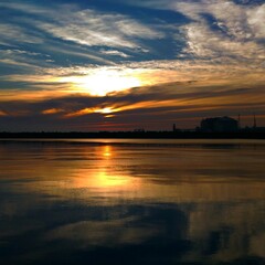 Obraz premium sunset over the river