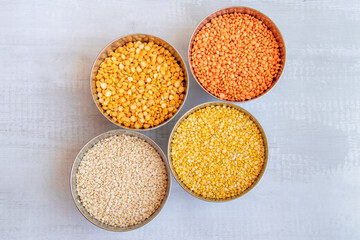 yellow lentils (Toor dal), mung dal (split mung beans), red lentils (masoor dal), vigna mungo (urad dal), split yellow chana dal (chana dal), bowls of cereal grains , group of lentils