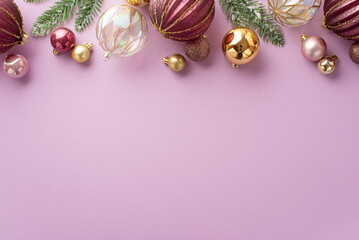 New Year decorations concept. Top view photo of pine branches in frost pink transparent and gold baubles balls on isolated pastel lilac background with blank space