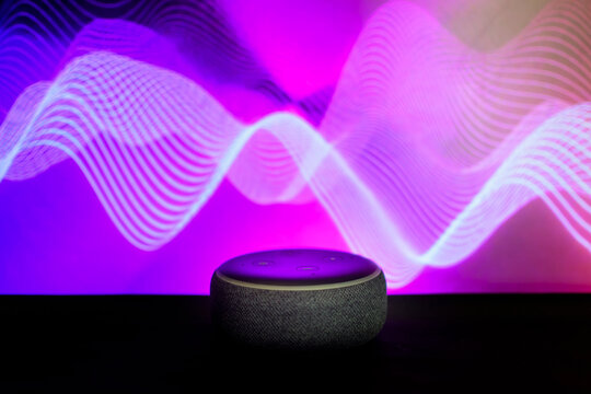 Bankura, West Bengal, India - September 24, 2022: Amazon Echo Dot third Generation with Built-in Alexa Smart Wi-Fi Speaker Black with colorful smoke background studio photography.