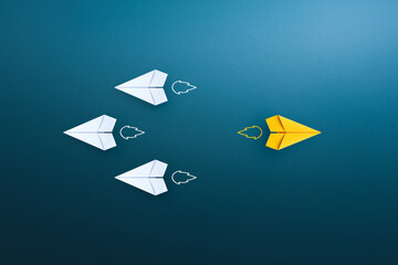 Yellow paper plane different from others. Business concept for new ideas creativity and innovative...