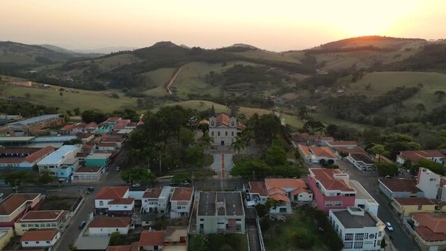 aerial view of a church in a small town in a valley  - Bueno Brandao, Minas Gerais - Brazil