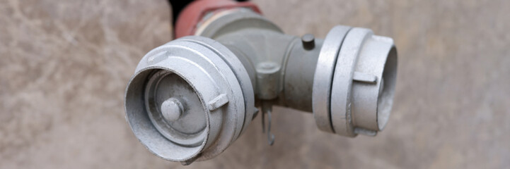 Double fire hydrant near the city wall closeup