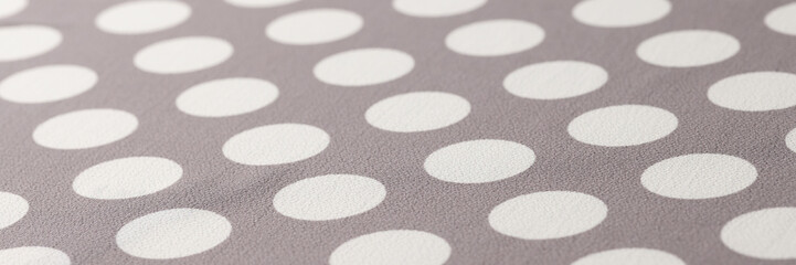 Seamless polka dots gray pattern closeup. Polka dot fabric