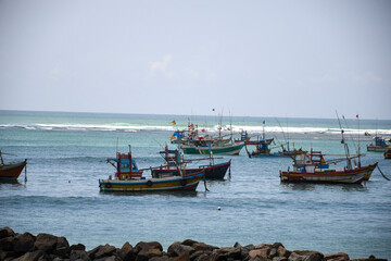 Fishing boats have been anchored in a harbour  