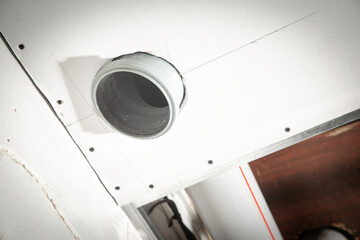Installation of chimney pipe at kitchen.