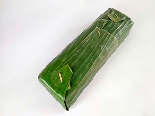 Tempe or tempeh, a typical Indonesian food made from fermented soybeans. Wrapped in banana leaves