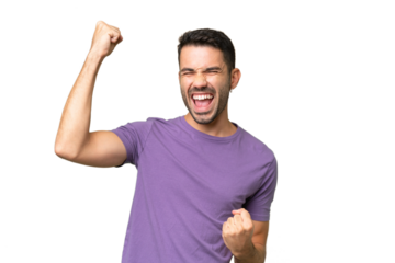 Young handsome caucasian man over isolated background celebrating a victory