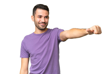 Young handsome caucasian man over isolated background giving a thumbs up gesture