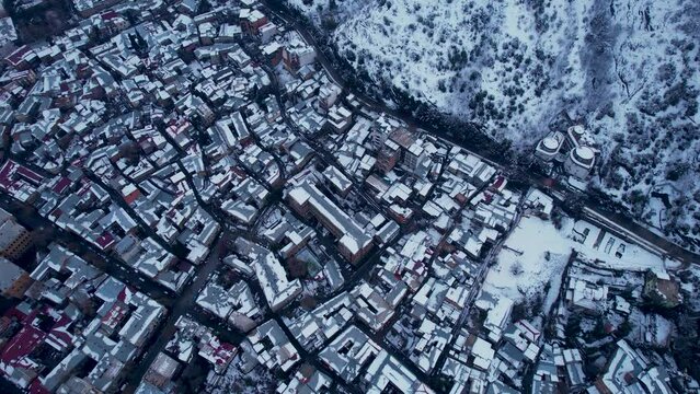 Snow-Cowered Roofs In The Winter City