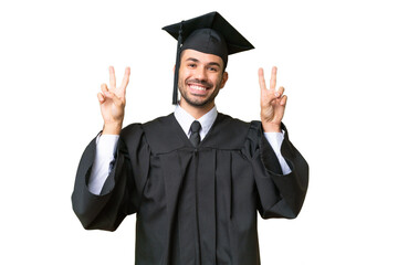 Young university graduate man over isolated background showing victory sign with both hands