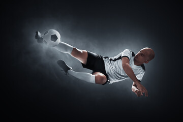 Soccer player on dark background