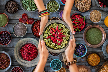 Dried vegetables at the hands of two women