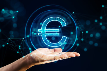 Close up of businessman hand holding creative glowing euro hologram on dark backround. Futuristic hi-tech digital money and electronic economy of the future concept.