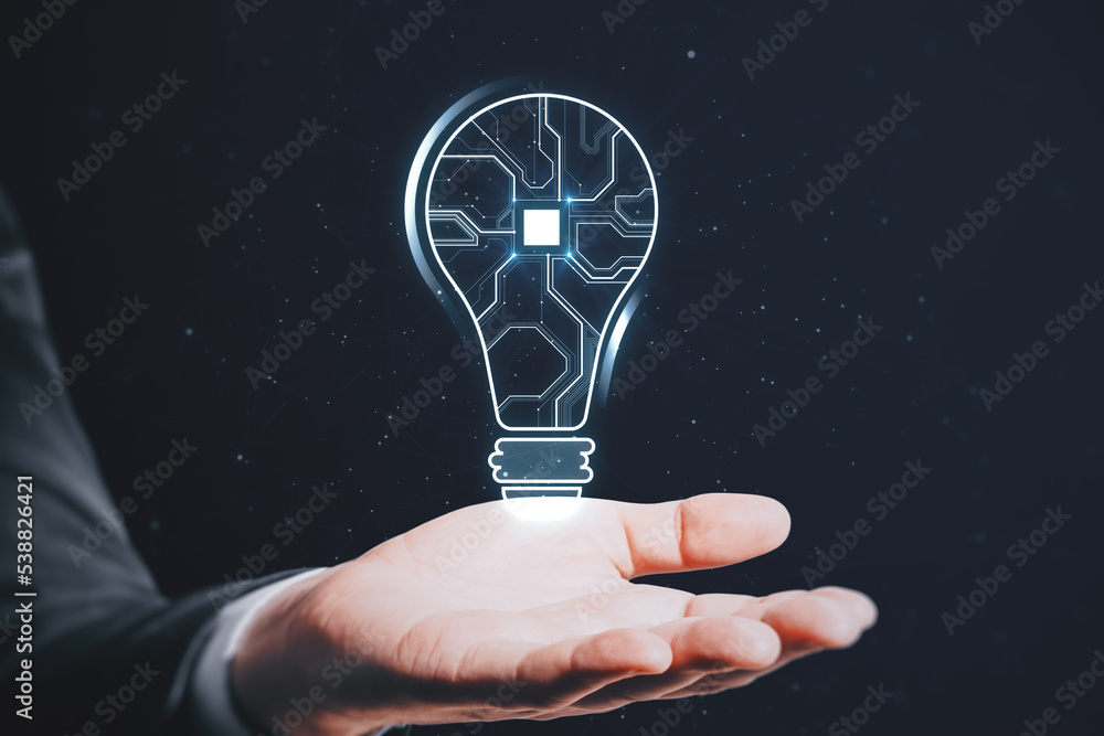 Poster close up of businessman hand holding abstract glowing light bulb with chip hologram on blurry dark b