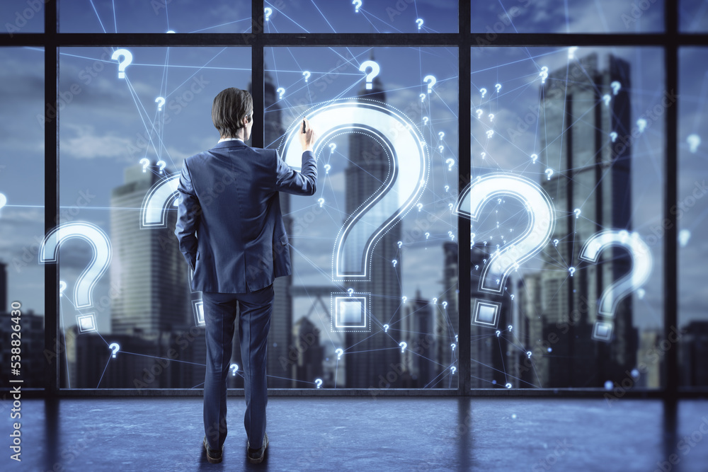 Poster back view of young businessman drawing glowing polygonal question mark on blurry office and window w