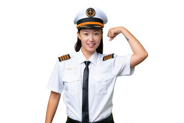Airplane pilot Asian woman over isolated background doing strong gesture