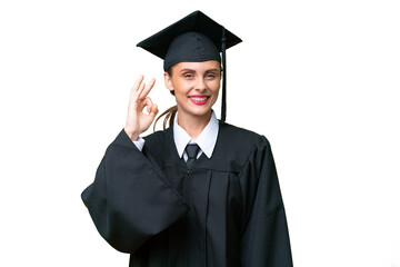 Young university graduate  caucasian woman over isolated background showing ok sign with fingers