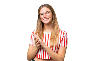 Young beautiful woman over isolated background applauding after presentation in a conference