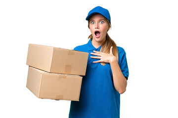 Delivery caucasian woman over isolated background surprised and shocked while looking right