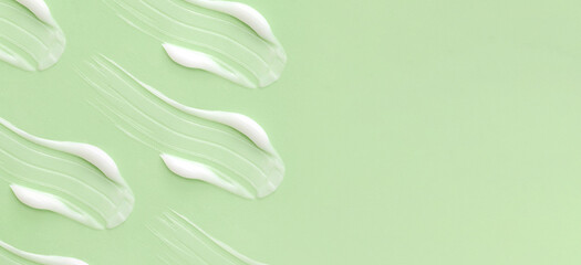 cosmetic smears cream texture on pastel background view with place for text	