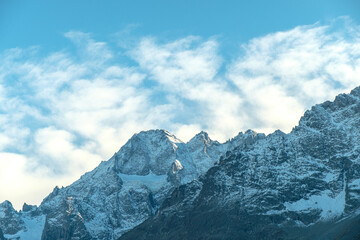 Obraz premium snow-covered mountains and clouds in the Alps near La grave. Mountain top near Grenoble