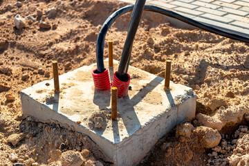 The ends of the electrical cable in the trench. electrical cable installation. Foundation for...