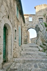 A narrow street between the old stone houses of Bagnoli del Trigno, a medieval village in the Molise region of Italy.