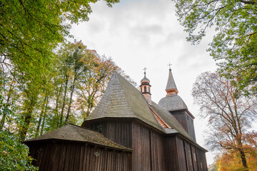 St. Nicholas in Polanka Wielka..Timber architecture with a log structure. The temple is covered with shingles and the facade is made of wooden boards in a vertical arrangement. Polanka Wielka, Poland