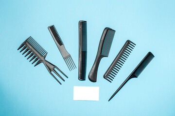 combs and hairdresser tools on blue background top viewcombs and hairdresser tools on blue background top view