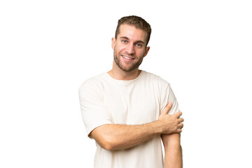 Young handsome caucasian man isolated on green chroma background laughing