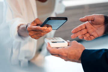 Woman paying through smart phone