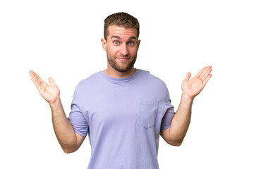 Fototapeta premium Young handsome caucasian man isolated on green chroma background making doubts gesture