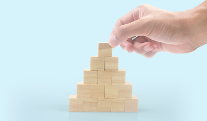 Wooden cubes in hand with copy space for input wording