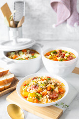 Smoked sausage minestrone. Italian soup with pasta and seasonal vegetables.
