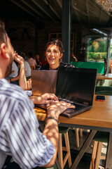 Fototapeta premium Business people having a fun conversation in a coffee bar