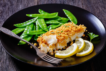 Baked Cod with Crackers toppings and snow peas