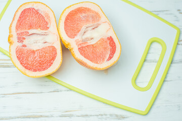 grapefruit banana, woman's hand